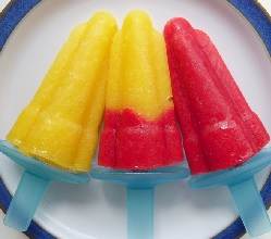 A yellow, Tandem and red ice lolly on a plate